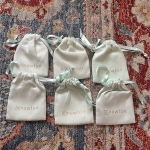eNewton White Jewelry Pouches